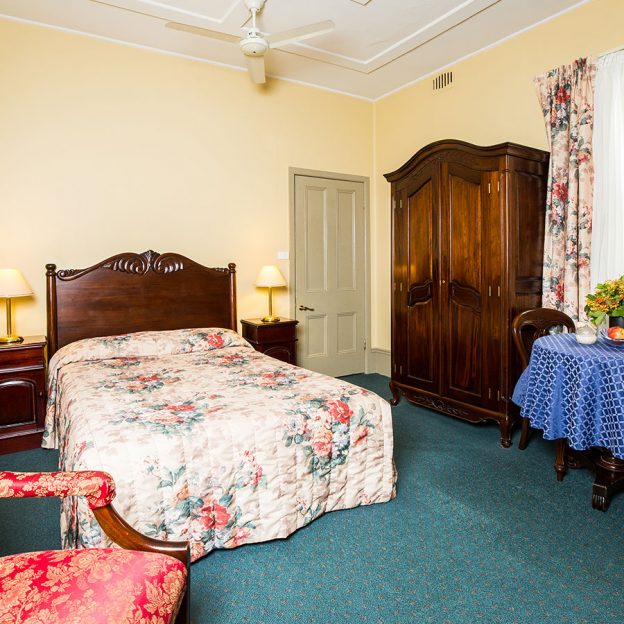 twin bed with good mattress and high-quality sheets in Avonmore on the Park Randwick accommodation